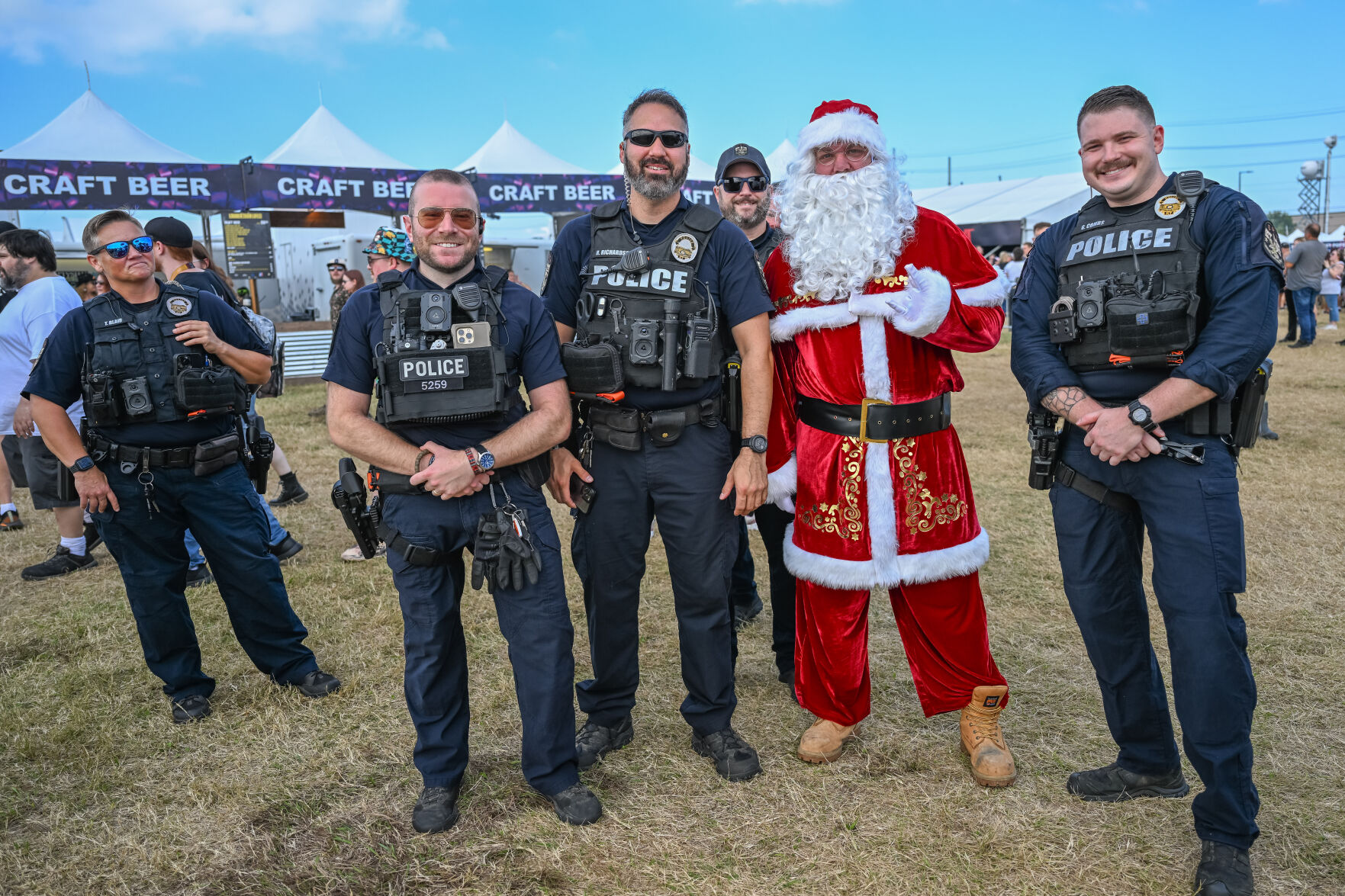 Santa Claus and LMPD pose for photo at Louder Than Life 2024 in Louisville